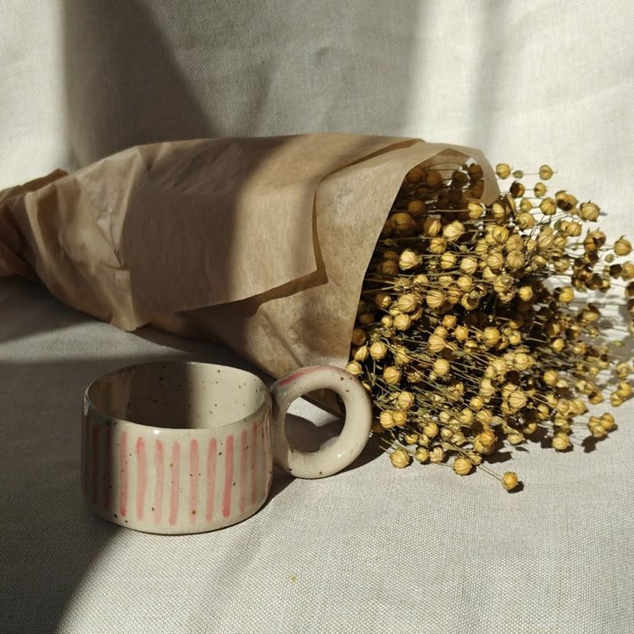 Ring-handle mug with dried flowers